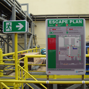Escape route signage in line with the escape plan in industrial environments.