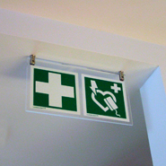 Signs to identify the position of present first aid or rescue equipment.